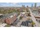 Wide aerial view of the apartment building and surrounding neighborhood with a downtown skyline at 230 E 9Th St # 401, Indianapolis, IN 46204