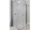 Modern shower featuring a sleek design with glass doors, built-in shelving, and modern fixtures at 230 E 9Th St # 401, Indianapolis, IN 46204