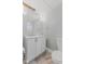 Bright bathroom featuring a vanity with ample storage, a toilet, and modern fixtures at 230 E 9Th St # 401, Indianapolis, IN 46204