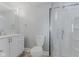 Bathroom featuring a vanity with modern fixtures, a toilet, and a glass-enclosed shower at 230 E 9Th St # 401, Indianapolis, IN 46204