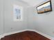 Cozy bedroom with hardwood floors, a window for natural light, and a TV for entertainment at 230 E 9Th St # 401, Indianapolis, IN 46204