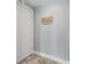 Welcoming foyer with tile flooring, a decorative welcome sign and coat rack by the door at 230 E 9Th St # 401, Indianapolis, IN 46204