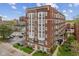Beautiful brick apartment building with white trim and a well maintained lawn and on-site parking at 230 E 9Th St # 401, Indianapolis, IN 46204