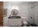Modern bathroom with black and white tile, glass shower, and stylish vanity at 233 E Saint Joseph St # 2G, Indianapolis, IN 46202