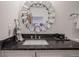Stylish bathroom with modern vanity and decorative mirror at 233 E Saint Joseph St # 2G, Indianapolis, IN 46202
