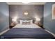 Inviting bedroom with textured wallpaper and a comfortable queen bed at 233 E Saint Joseph St # 2G, Indianapolis, IN 46202