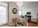 Open concept dining area featuring a round table, stylish chairs, modern art and a view to the living room and kitchen at 233 E Saint Joseph St # 2G, Indianapolis, IN 46202
