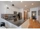 Modern kitchen with granite countertops, stainless steel appliances, white cabinets, hardwood flooring and kitchen island at 233 E Saint Joseph St # 2G, Indianapolis, IN 46202