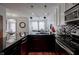 Kitchen featuring granite counters, stainless appliances and a view of the living area at 233 E Saint Joseph St # 2G, Indianapolis, IN 46202