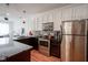 Kitchen featuring stainless steel appliances, granite counters and white cabinets at 233 E Saint Joseph St # 2G, Indianapolis, IN 46202