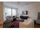Inviting living room with modern furniture, plush seating, a large window, and natural light at 233 E Saint Joseph St # 2G, Indianapolis, IN 46202