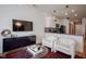 Living room showcasing modern furniture, plush seating, a flat screen TV, and a view to the kitchen at 233 E Saint Joseph St # 2G, Indianapolis, IN 46202