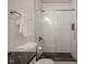 Elegant shower with glass doors and white vertical tiles at 233 E Saint Joseph St # 2G, Indianapolis, IN 46202