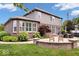 Relax in the backyard on the brick patio with outdoor seating and views of the lush landscaping at 2705 April Springs View, Carmel, IN 46074