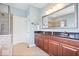 Stylish bathroom with a tiled shower, soaking tub, granite countertops, and a double vanity at 2705 April Springs View, Carmel, IN 46074