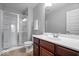 Bright bathroom featuring a shower, sink with vanity and a toilet at 2705 April Springs View, Carmel, IN 46074