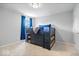 Neutral bedroom with a dark bunk bed, blue bedding, and light gray walls, creating a cozy atmosphere at 2705 April Springs View, Carmel, IN 46074