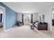 Bonus room with neutral carpeting, contemporary furniture, and two sunny windows at 2705 April Springs View, Carmel, IN 46074