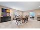 Dining room with carpet, long wood table with 6 black chairs, dark furniture, and neutral colored walls at 2705 April Springs View, Carmel, IN 46074