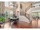 Stunning dining area featuring a dramatic chandelier, grand staircase and ample natural light at 2705 April Springs View, Carmel, IN 46074
