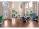 Elegant dining room with high ceilings, large windows, and wood floors providing an open and inviting space at 2705 April Springs View, Carmel, IN 46074