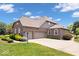Charming brick home featuring a spacious driveway and well-manicured landscaping at 2705 April Springs View, Carmel, IN 46074