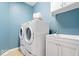 Functional laundry room with a washer, dryer, sink, and cabinet space, perfect for everyday convenience at 2705 April Springs View, Carmel, IN 46074