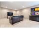 Cozy living room with a comfortable leather sofa, modern TV setup, and stylish decor at 2705 April Springs View, Carmel, IN 46074