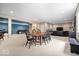 Large living room featuring a blue accent wall, neutral carpet, a leather sofa, and entertainment area at 2705 April Springs View, Carmel, IN 46074