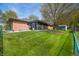 Expansive backyard with lush lawn, shed, and screened porch for outdoor relaxation and storage at 273 N Serenity Way, Greenwood, IN 46142