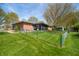Fenced backyard with lawn, brick home, and screened-in patio at 273 N Serenity Way, Greenwood, IN 46142