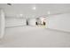 Expansive basement with carpet, open layout, recessed lighting and staircase to the upper floors at 273 N Serenity Way, Greenwood, IN 46142