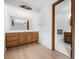 Bathroom features a spacious vanity, a large mirror with Hollywood lights, and a tiled floor at 273 N Serenity Way, Greenwood, IN 46142