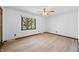 Bedroom with hardwood floors, ceiling fan, window, and neutral walls at 273 N Serenity Way, Greenwood, IN 46142