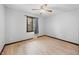 Bedroom with hardwood floors, ceiling fan, window with curtains, and neutral walls at 273 N Serenity Way, Greenwood, IN 46142
