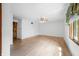 Large bedroom with wood-look floors, a ceiling fan, and a bright window at 273 N Serenity Way, Greenwood, IN 46142