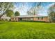 Charming brick home featuring a well-maintained lawn and manicured hedges at 273 N Serenity Way, Greenwood, IN 46142