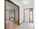 Inviting foyer with tile and wood flooring, leading to a bright living area at 273 N Serenity Way, Greenwood, IN 46142
