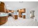 Open kitchen with oak cabinets, center island and white appliances at 273 N Serenity Way, Greenwood, IN 46142