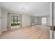 Bright living room with wood flooring, windows with curtains, and neutral walls at 273 N Serenity Way, Greenwood, IN 46142