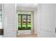 View of the front of the house through shutters in a living room with wood floors at 273 N Serenity Way, Greenwood, IN 46142