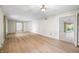 Open living room with wood floors and access to the outdoor patio through sliding doors at 273 N Serenity Way, Greenwood, IN 46142