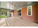 Relaxing sunroom with brick accents, ceiling fan, and wood-look floors at 273 N Serenity Way, Greenwood, IN 46142