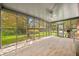 Inviting sunroom with large windows and serene backyard views at 273 N Serenity Way, Greenwood, IN 46142