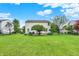 Large backyard with a lush lawn and mature trees, perfect for outdoor activities and relaxation at 286 Fairfax Ln, Greenwood, IN 46142