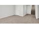 Spacious carpeted basement with multiple doors, offering potential for a flexible living space at 286 Fairfax Ln, Greenwood, IN 46142