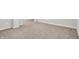 Wide angle shot of a neutral carpeted basement space with white trim and baseboards at 286 Fairfax Ln, Greenwood, IN 46142