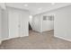 Finished basement area with stairs and an open doorway, offering potential for various uses at 286 Fairfax Ln, Greenwood, IN 46142