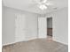 Spacious bedroom featuring neutral paint, ceiling fan, and access to upper level at 286 Fairfax Ln, Greenwood, IN 46142