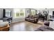 Inviting living room with hardwood floors, a comfortable couch, and seamless access to the kitchen at 286 Fairfax Ln, Greenwood, IN 46142